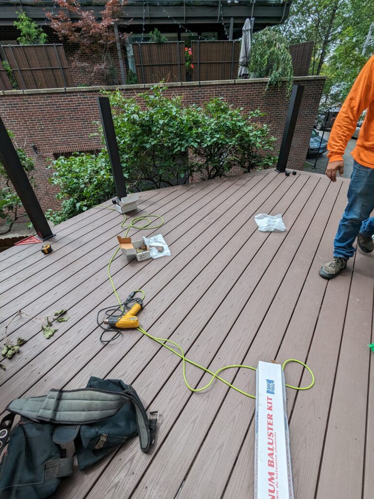 worker giving last touches to a deck in chicago